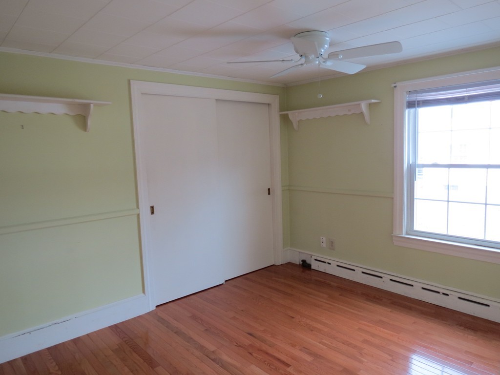 30 Harvard Road Shirley, MA 01464 - Photo 23 of 28 an empty room with wooden floor and windows