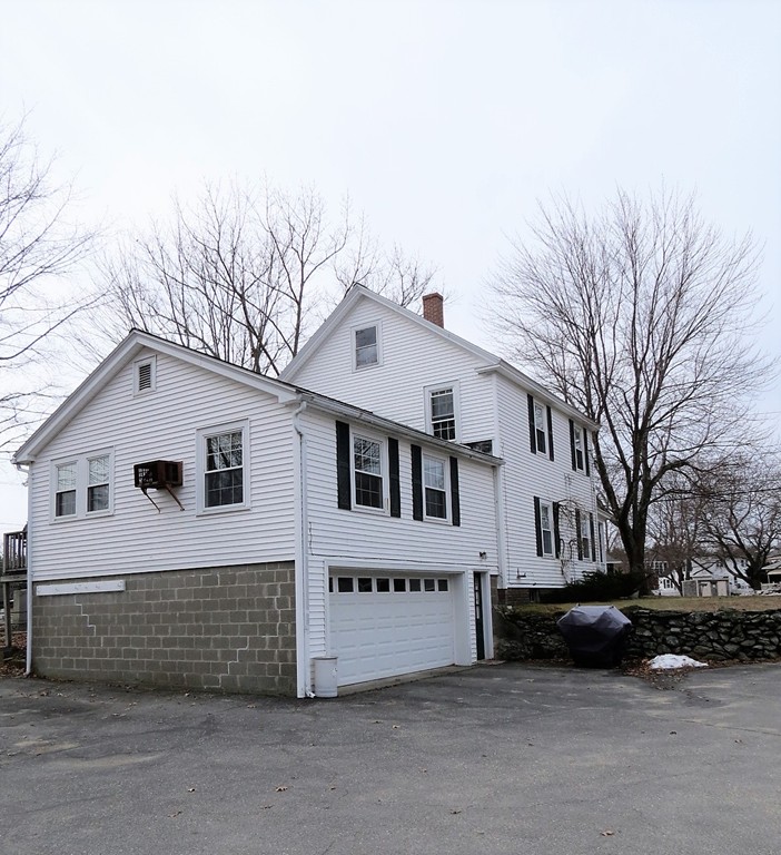 30 Harvard Road Shirley, MA 01464 - Photo 26 of 28 a view of a white house with a large tree