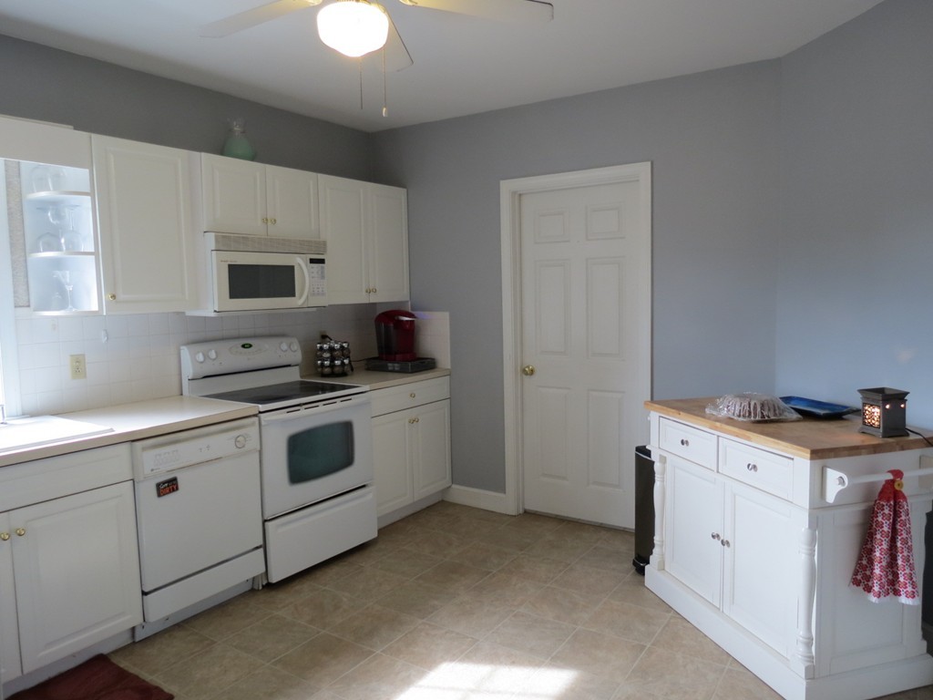 30 Harvard Road Shirley, MA 01464 - Photo 8 of 28 a kitchen with a stove and a sink