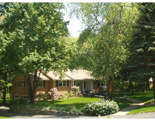 47 Jeffrey Road Wayland, MA 01778 - Photo 1 of 9 front view of a house with a tree in front of it