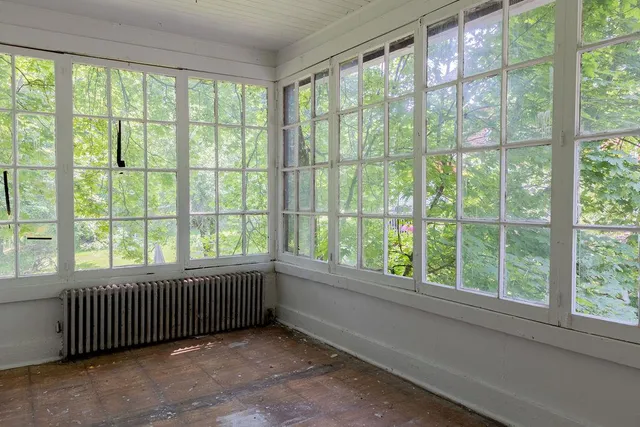 a view of an empty room and window