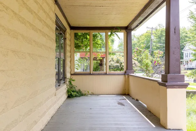 a view of a room with a large window