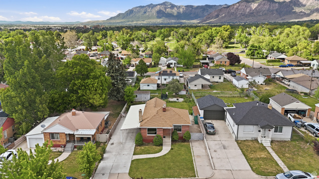 774 37th Street South Ogden, UT 84403 - Photo 40 of 47 Residential property featuring a red brick facade, a brown shingle roof, and a covered carport