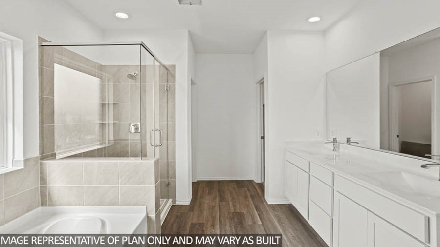 211 Homestead Court Dayton, TX 77535 - Photo 8 of 21 a spacious bathroom with a shower and a sink