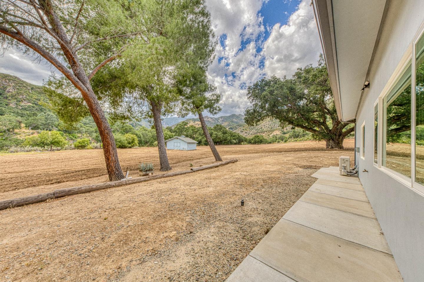 47317 Arroyo Seco Road Greenfield, CA 93927 - Photo 16 of 47 a view of a yard with plants and trees