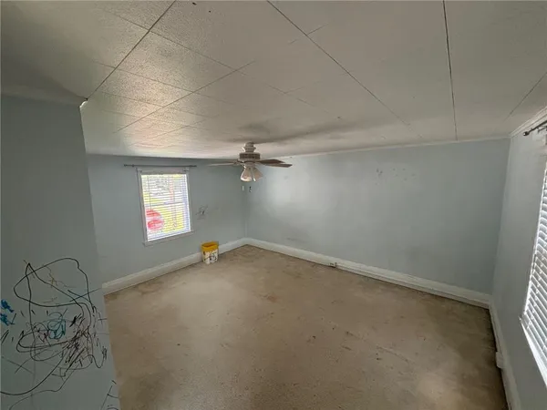 an empty room with windows