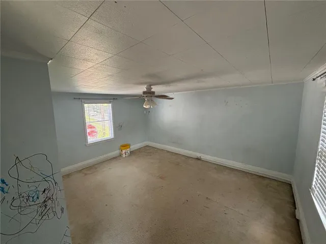 an empty room with windows