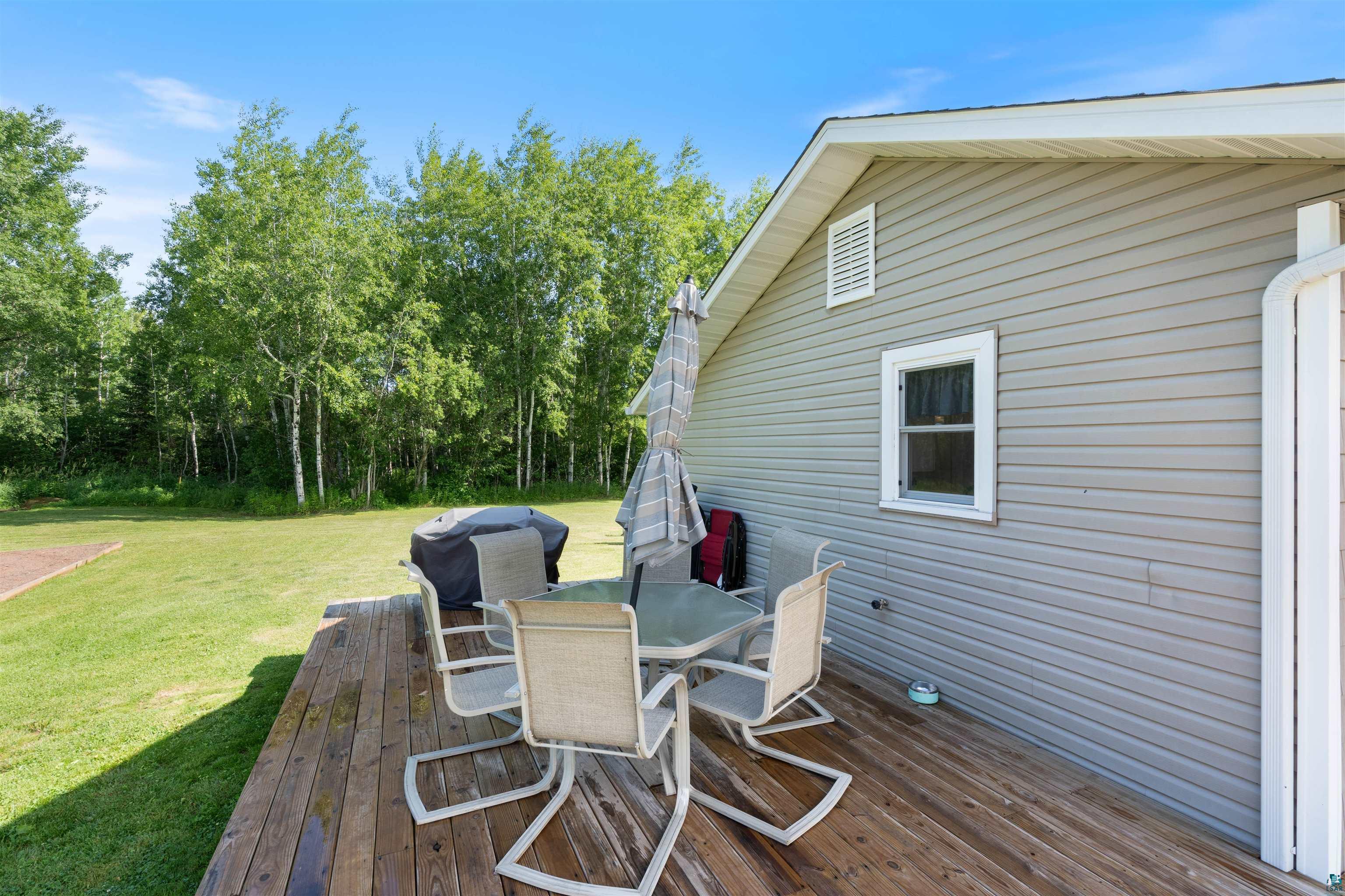 3835 South County Rd K South Range, WI 54874 - Photo 20 of 29 Expansive wood-finish deck offering ample outdoor living space