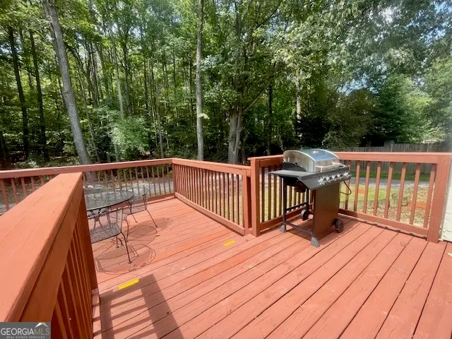 a view of a balcony with a table and chairs