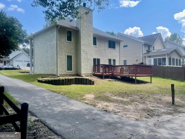 a view of backyard with a garden and entertaining space