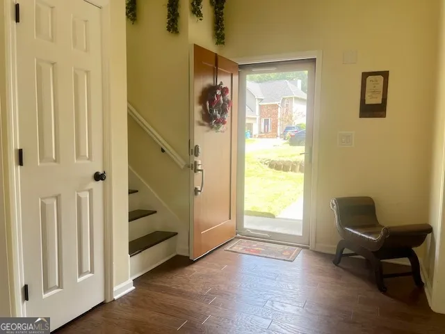 a kitchen with stainless steel appliances granite countertop a stove and white cabinets