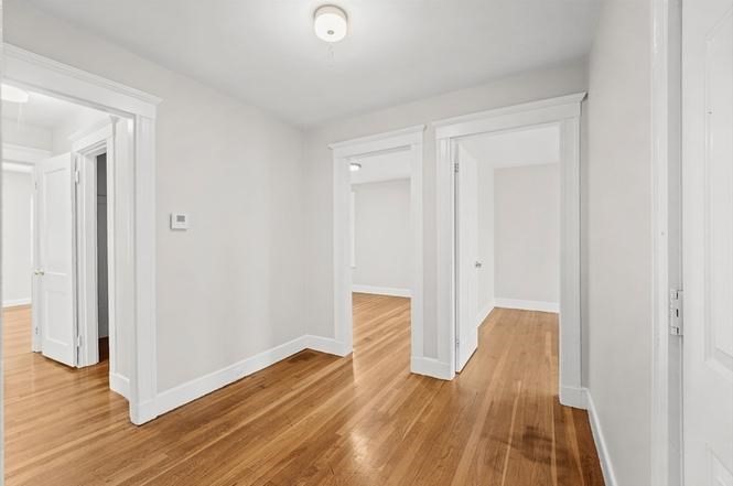 40 Ripley Road, Unit 2 Boston, MA 02121 - Photo 6 of 25 a view of room with wooden floor