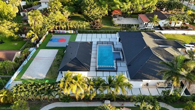 an aerial view of residential houses with yard