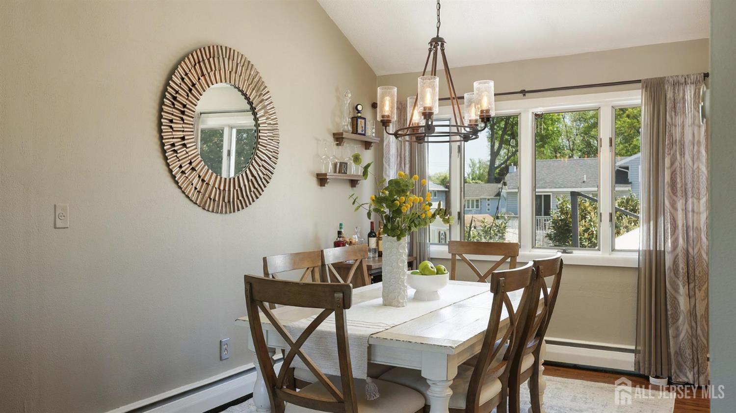 47 Miliken Road Colonia, NJ 07067 - Photo 10 of 40 a dining room with furniture a rug and a window