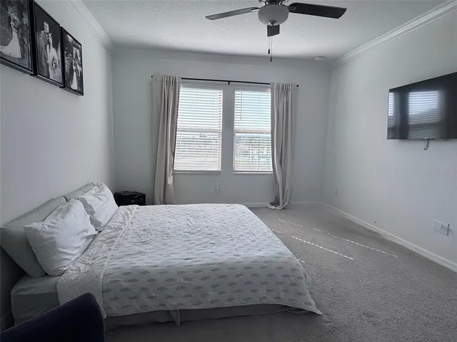 a bathroom with a double vanity sink a mirror and a shower