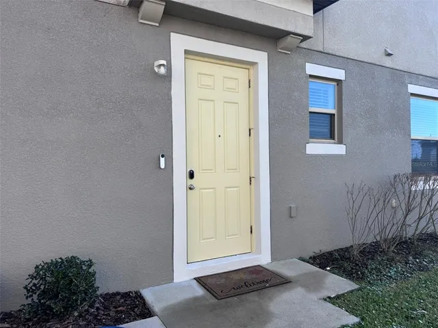 a kitchen with stainless steel appliances granite countertop a stove a sink a microwave a dining table and chairs