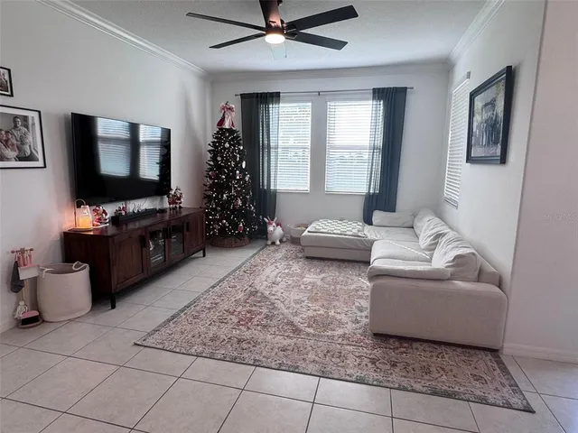 a view of kitchen with refrigerator and microwave