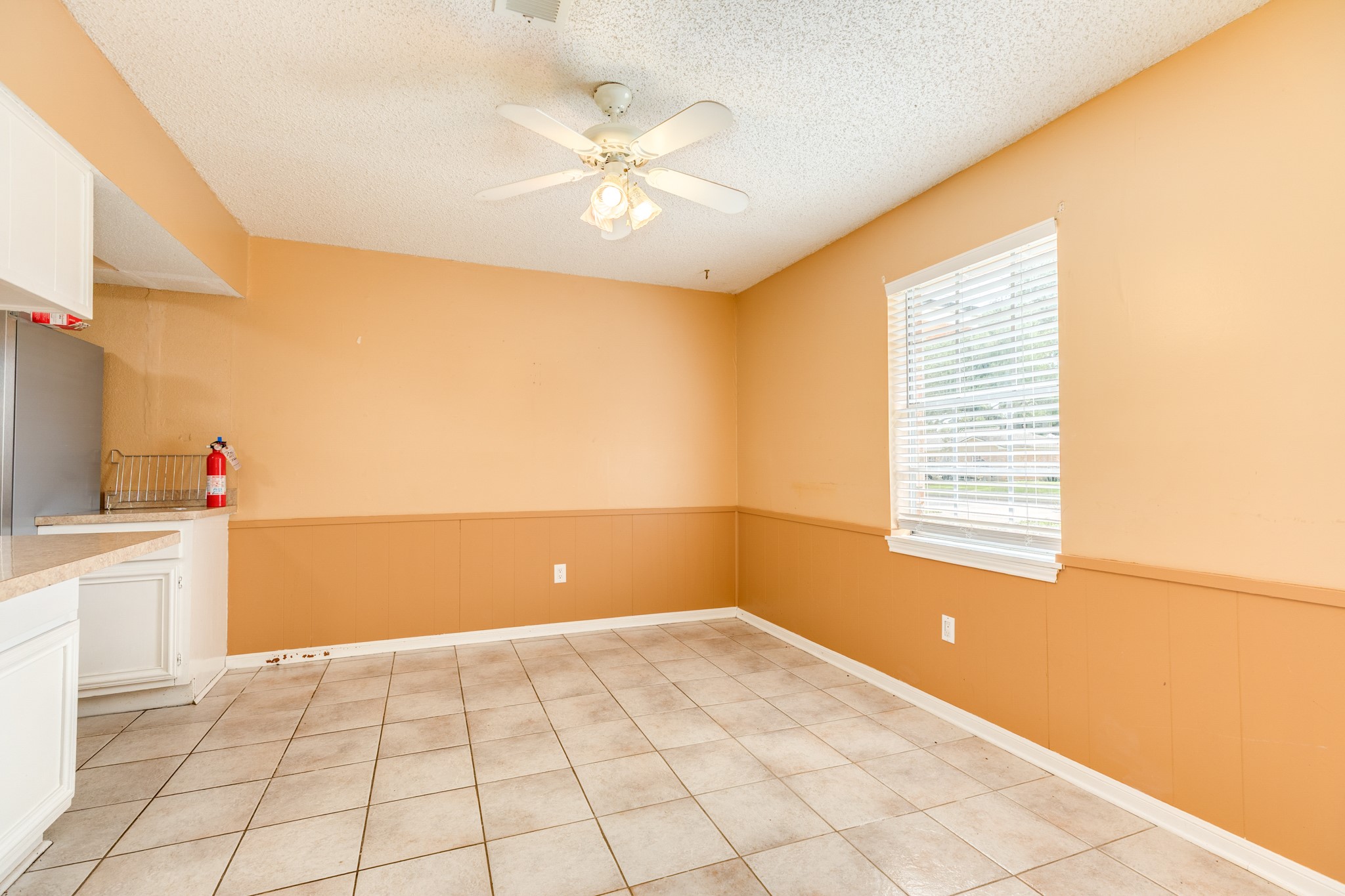 1030 Maple Street Clute, TX 77531 - Photo 12 of 25 a view of a livingroom with an empty space and a window