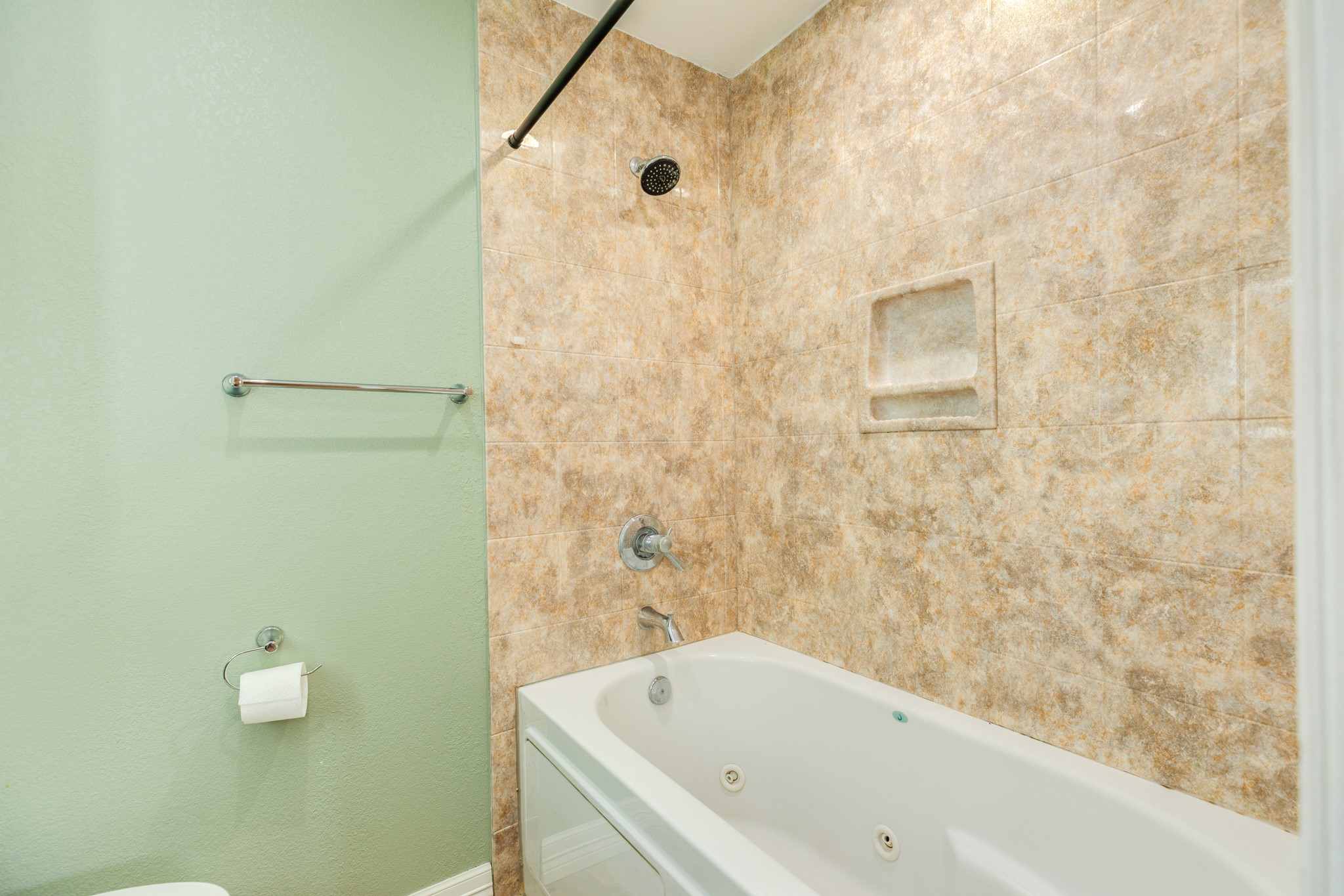 1030 Maple Street Clute, TX 77531 - Photo 18 of 25 a bathroom with a bathtub