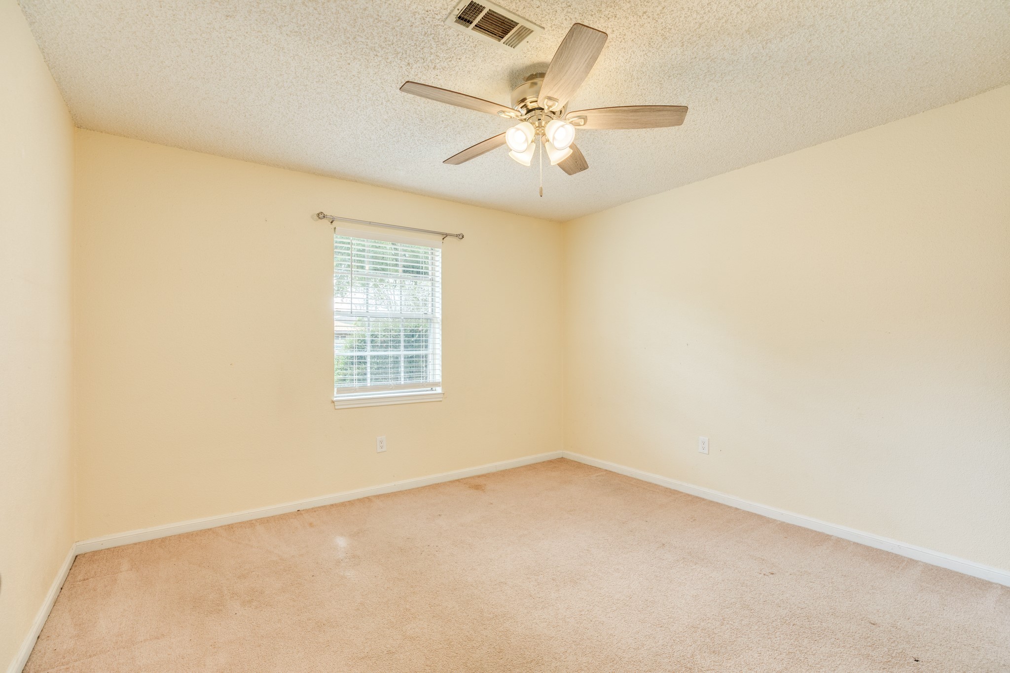 1030 Maple Street Clute, TX 77531 - Photo 19 of 25 an empty room with a window