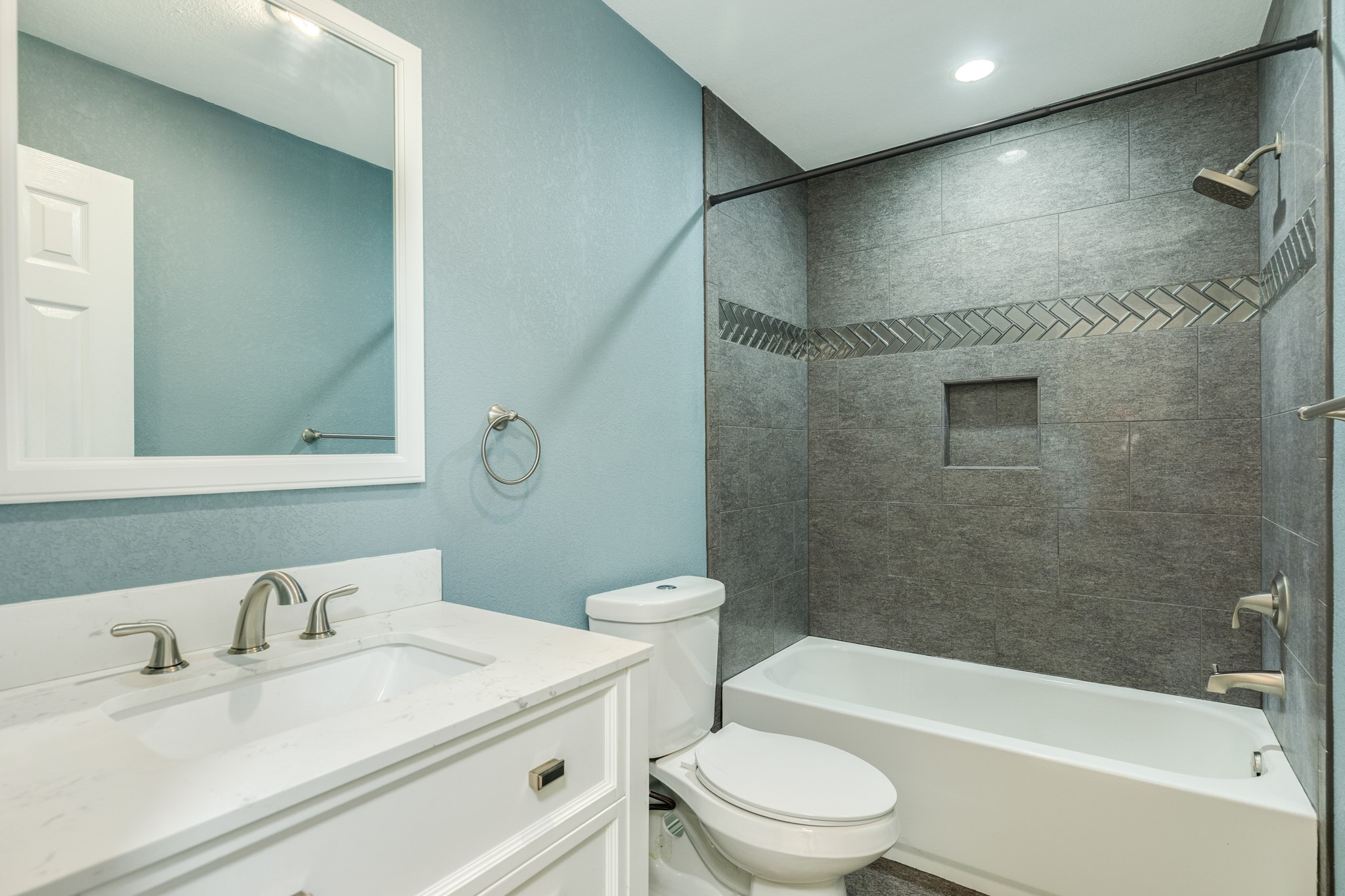 1030 Maple Street Clute, TX 77531 - Photo 21 of 25 a bathroom with a sink a toilet and shower