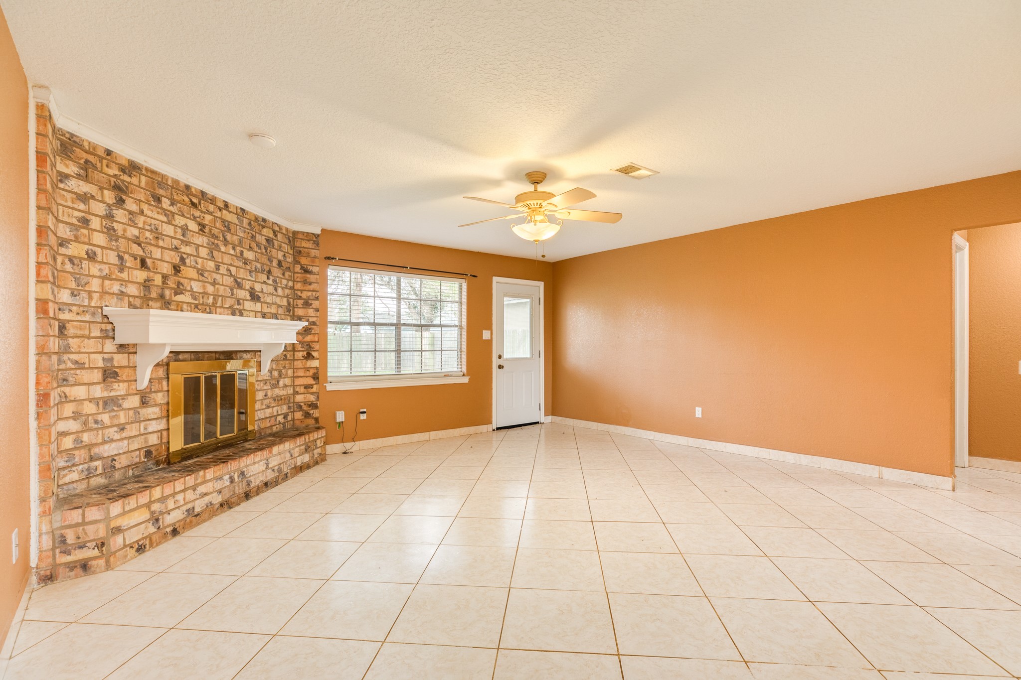 1030 Maple Street Clute, TX 77531 - Photo 6 of 25 a view of an empty room with a fireplace