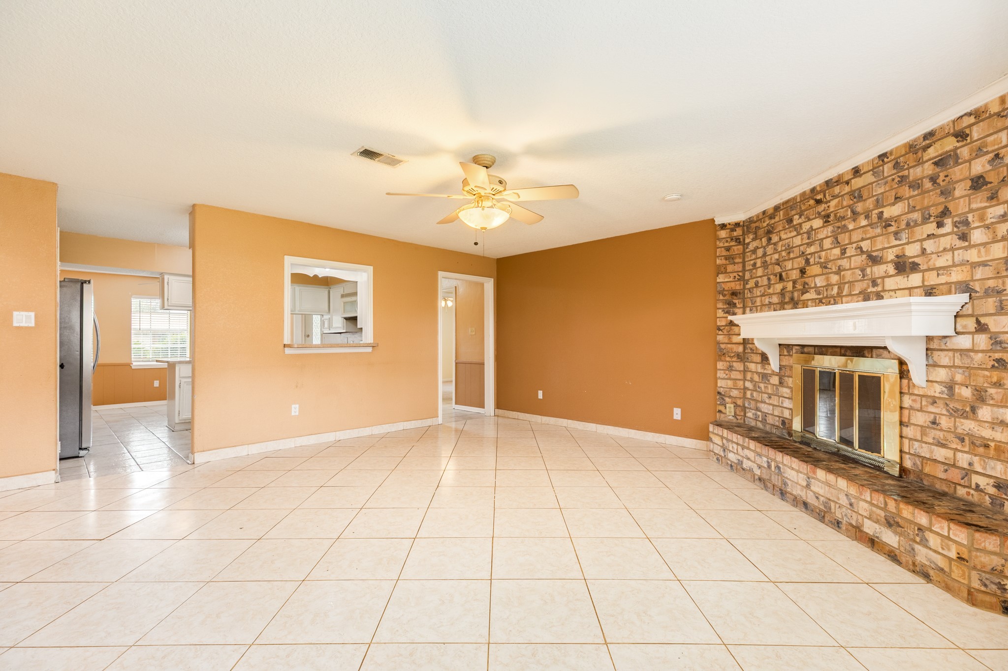 1030 Maple Street Clute, TX 77531 - Photo 7 of 25 a view of an empty room with glass door