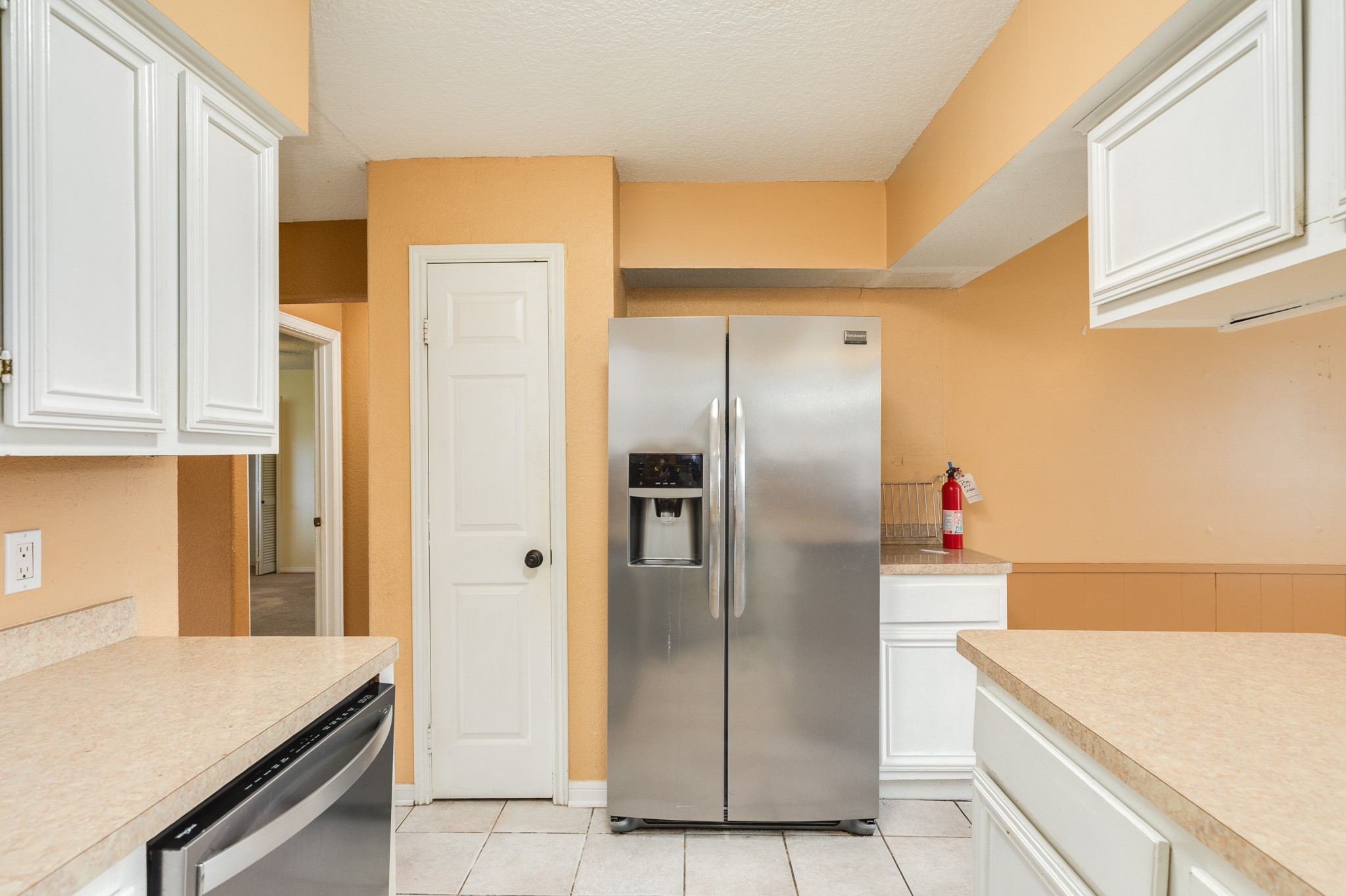 1030 Maple Street Clute, TX 77531 - Photo 10 of 25 a kitchen with stainless steel appliances granite countertop a refrigerator and a sink
