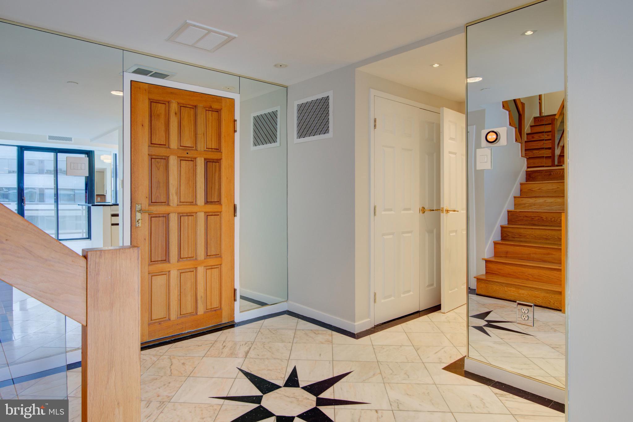 1530 Key Boulevard, Unit 1321 Arlington, VA 22209 - Photo 12 of 42 a view of a hallway with wooden floor and entryway
