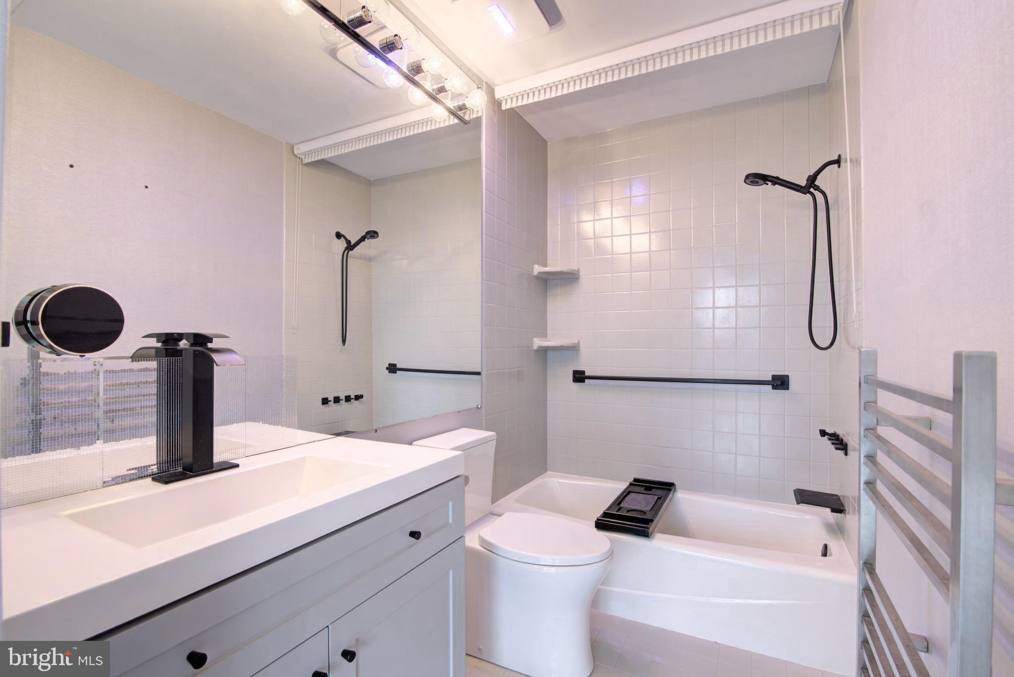 1530 Key Boulevard, Unit 1321 Arlington, VA 22209 - Photo 21 of 42 a bathroom with a sink a toilet and shower