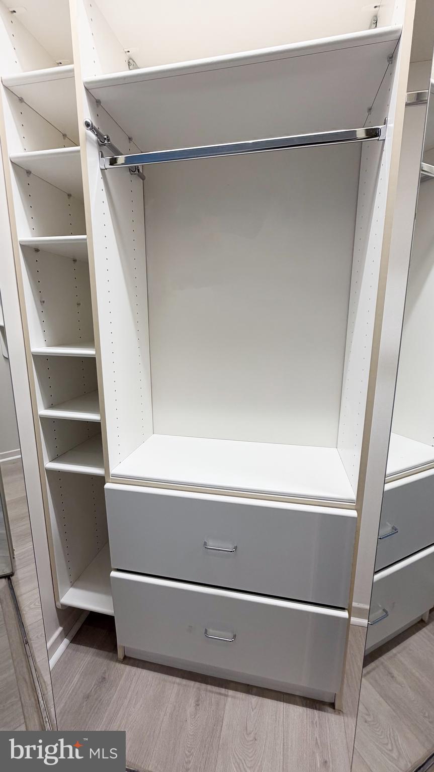 1530 Key Boulevard, Unit 1321 Arlington, VA 22209 - Photo 24 of 42 a view of walk in closet with empty racks