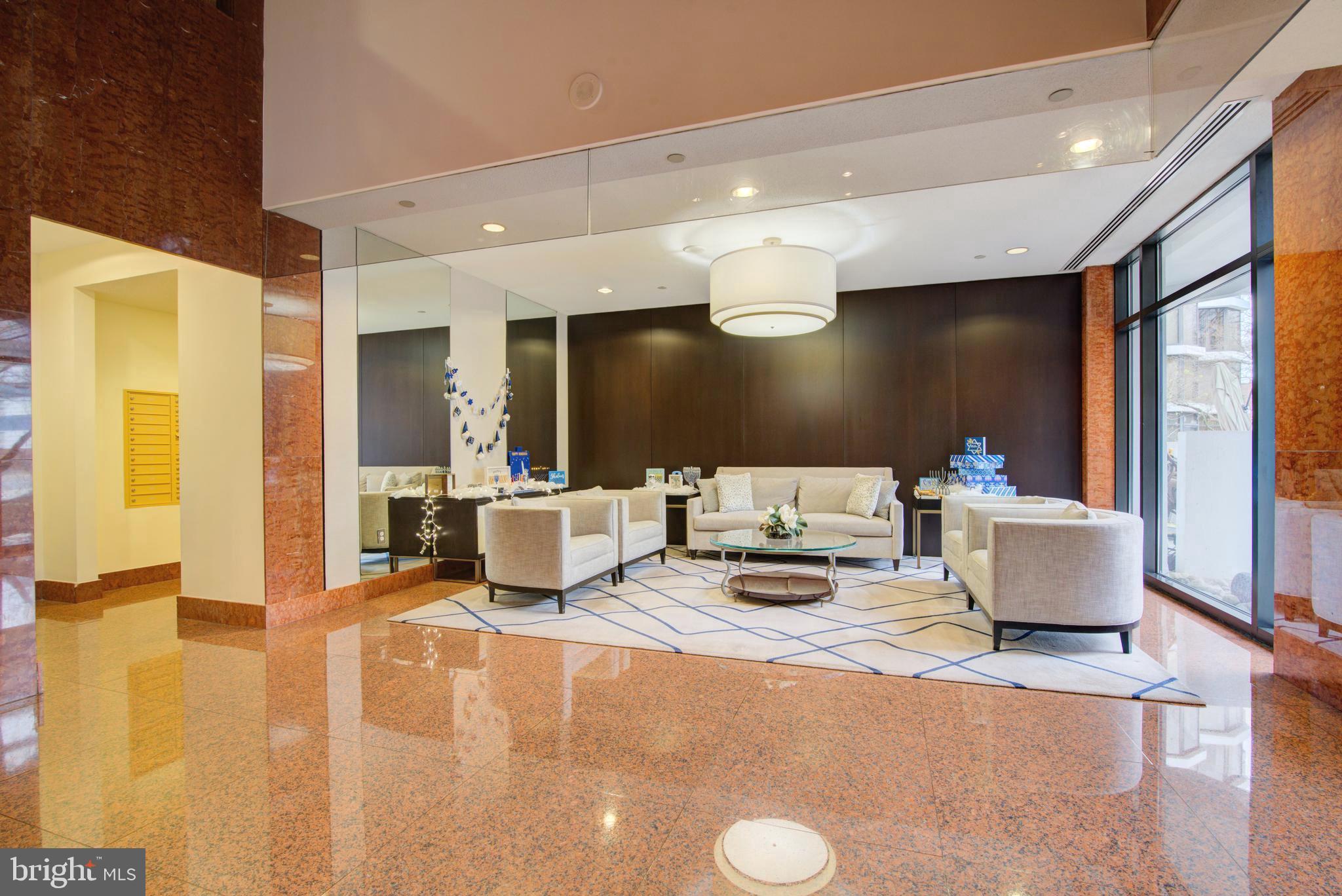 1530 Key Boulevard, Unit 1321 Arlington, VA 22209 - Photo 33 of 42 a lobby with furniture and a large window