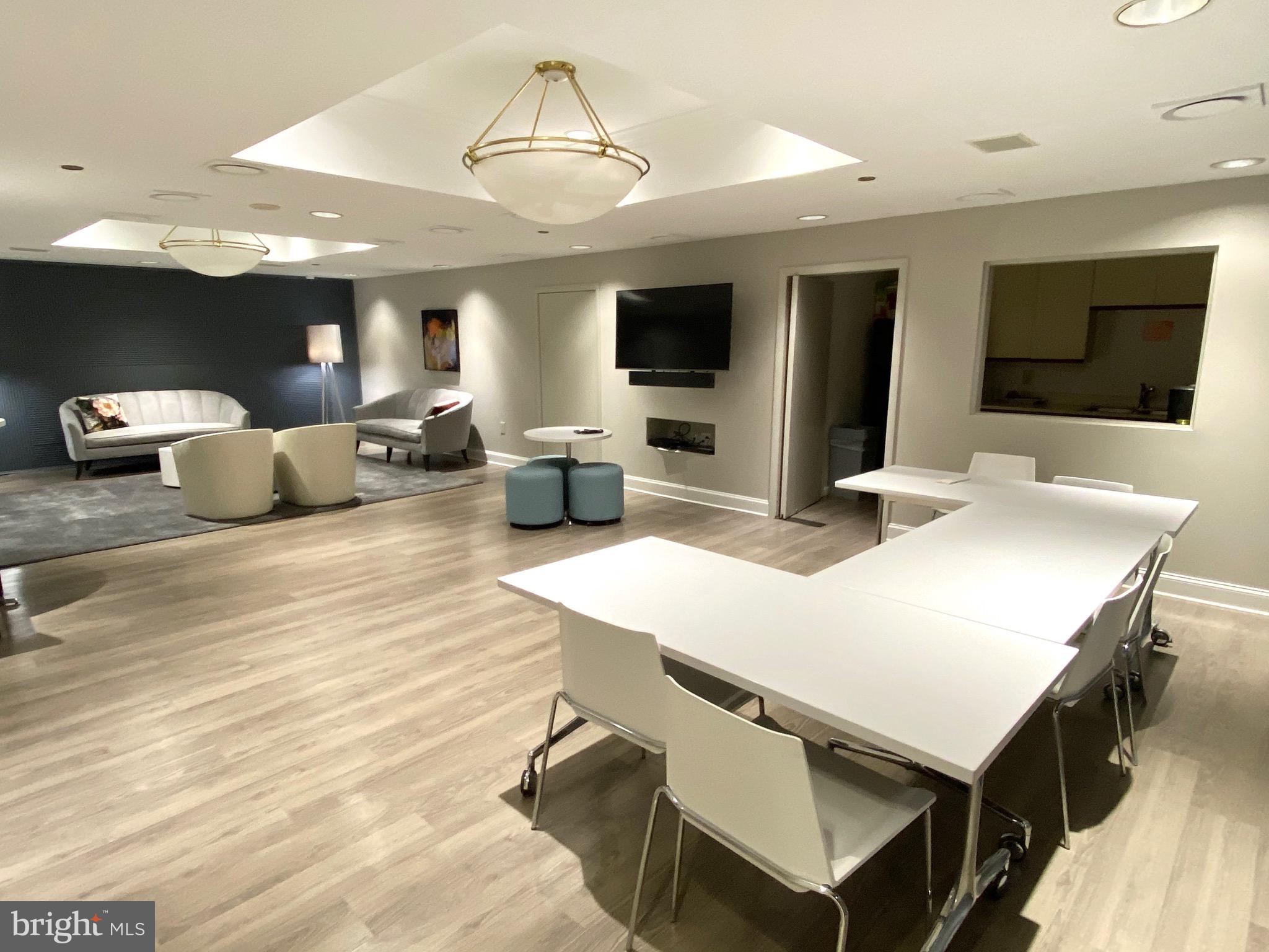 1530 Key Boulevard, Unit 1321 Arlington, VA 22209 - Photo 35 of 42 a view of a dining room with furniture and a chandelier