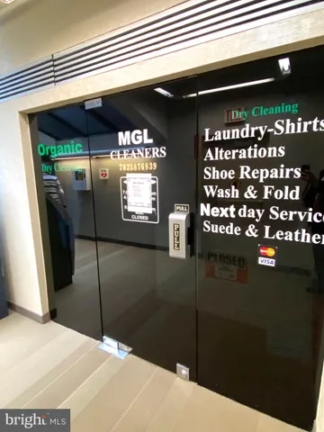 a lobby with furniture and a large window