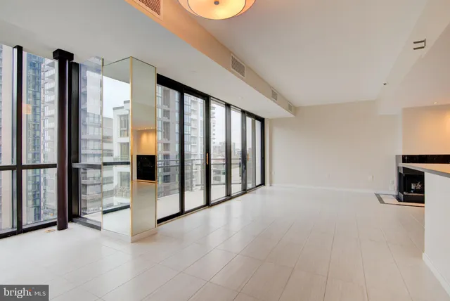 wooden floor with a fireplace in kitchen