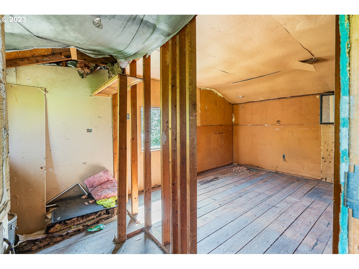 16315 Southeast Lincoln Street Portland, OR 97233 - Photo 11 of 32 a view of walk in closet with clothes and shoes
