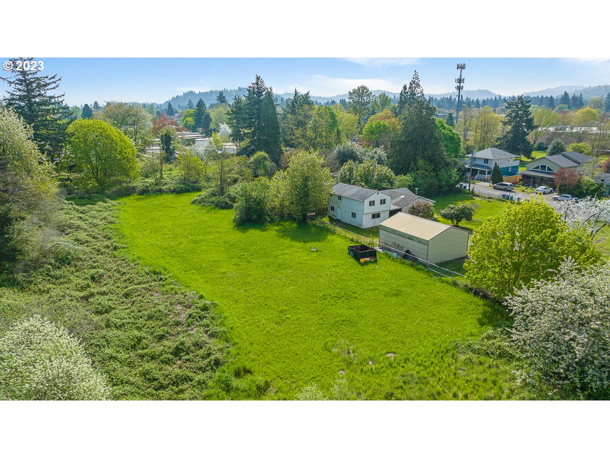 16315 Southeast Lincoln Street Portland, OR 97233 - Photo 18 of 32 a kitchen with lots of green trees