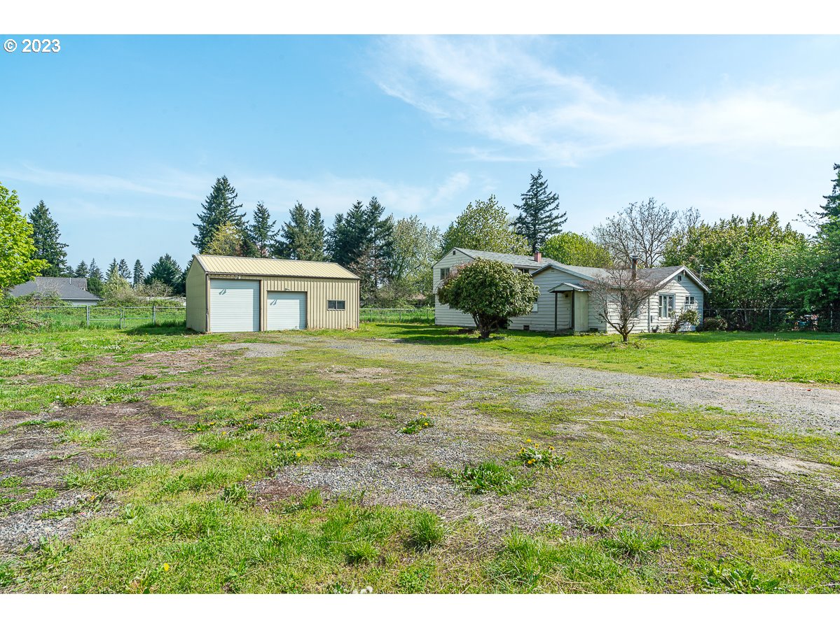 16315 Southeast Lincoln Street Portland, OR 97233 - Photo 2 of 32 a house view with a garden space