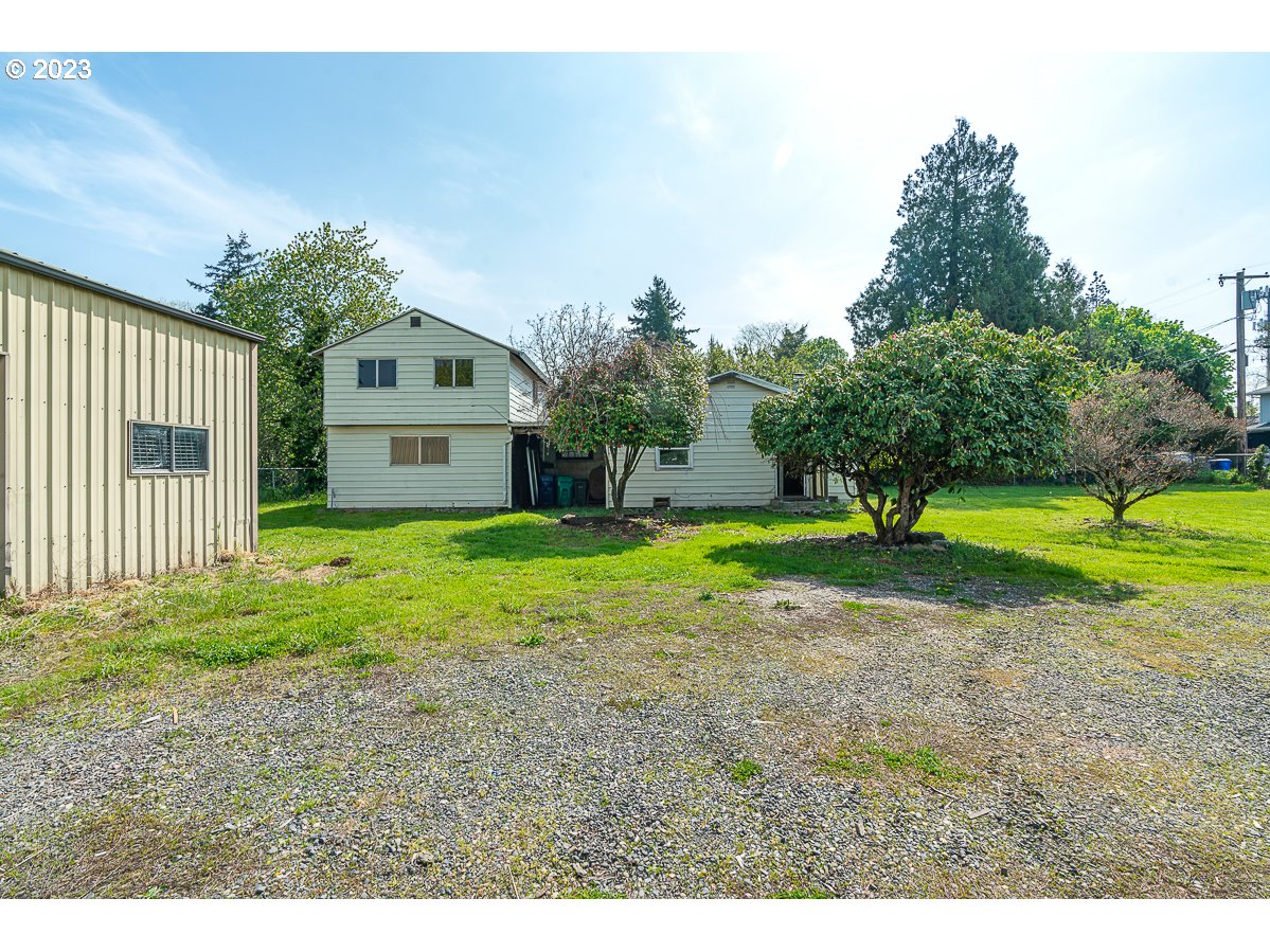 16315 Southeast Lincoln Street Portland, OR 97233 - Photo 3 of 32 a view of a house with a yard
