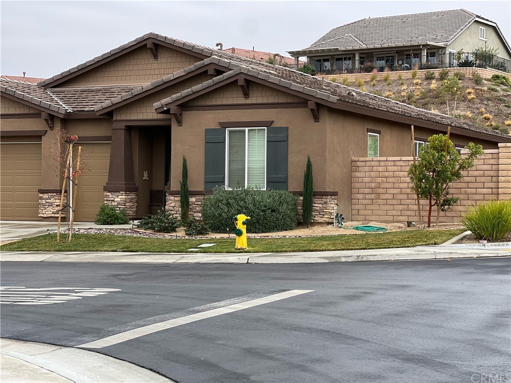 1603 Sams Canyon Beaumont, CA 92223 - Photo 15 of 18 a front view of a house with a yard