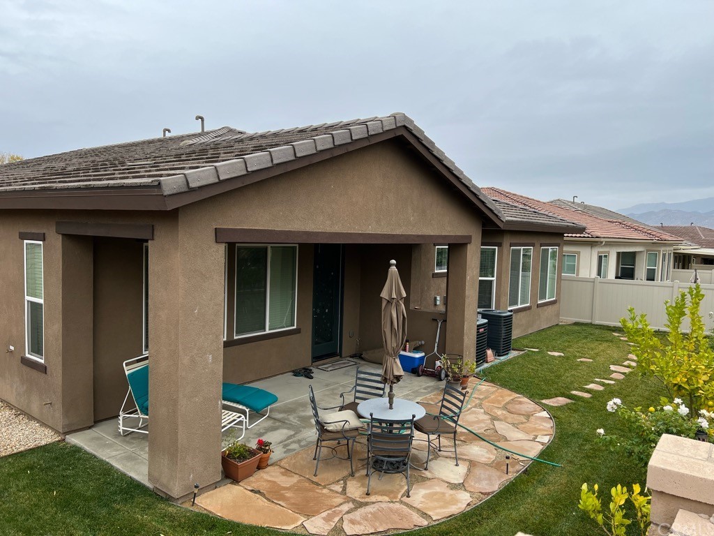 1603 Sams Canyon Beaumont, CA 92223 - Photo 16 of 18 a view of a house with backyard porch and sitting area