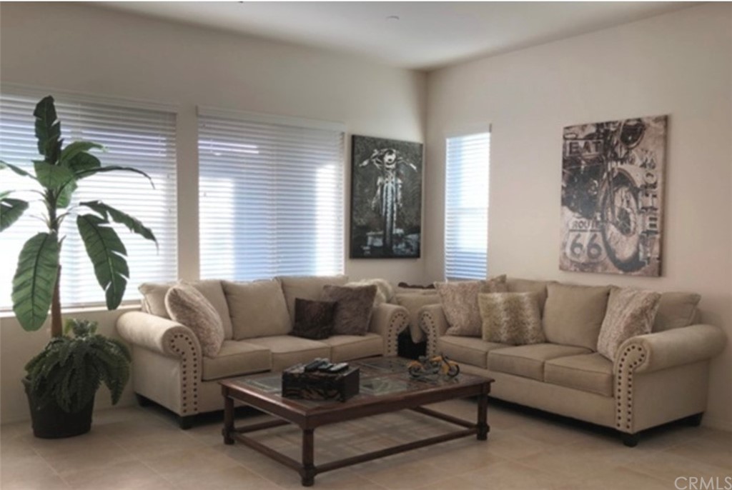 1603 Sams Canyon Beaumont, CA 92223 - Photo 4 of 18 a living room with furniture and a large window