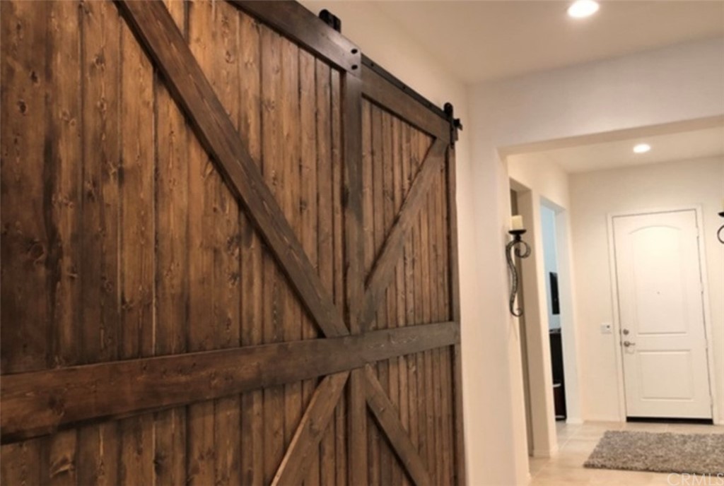 1603 Sams Canyon Beaumont, CA 92223 - Photo 6 of 18 a view of staircase with railing and white walls