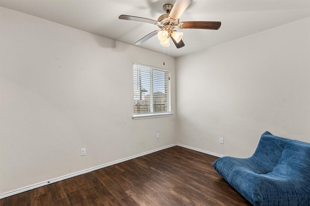 11233 Buzzard Gulch Drive Waco, TX 76708 - Photo 17 of 37 a view of workspace with wooden floor and ceiling fan