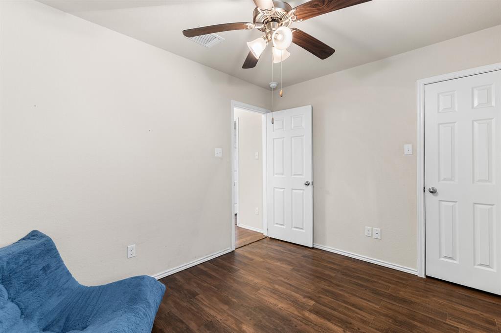 11233 Buzzard Gulch Drive Waco, TX 76708 - Photo 18 of 37 a view of an empty room with wooden floor