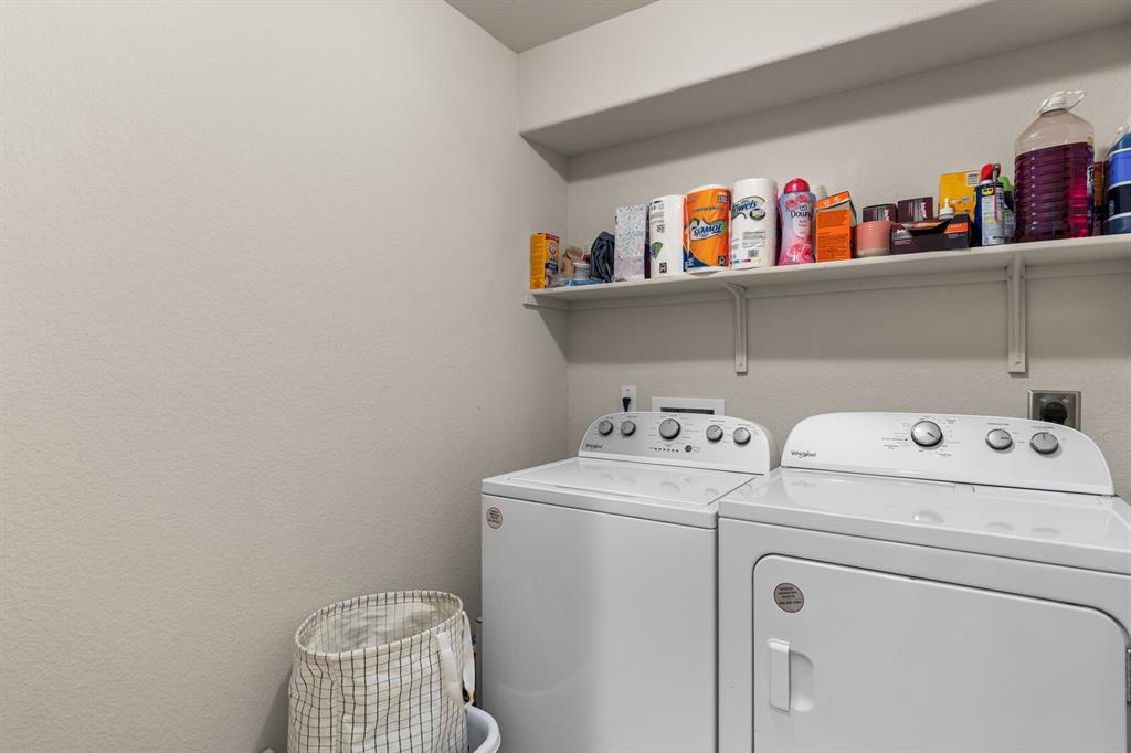 11233 Buzzard Gulch Drive Waco, TX 76708 - Photo 21 of 37 a utility room with dryer and washer
