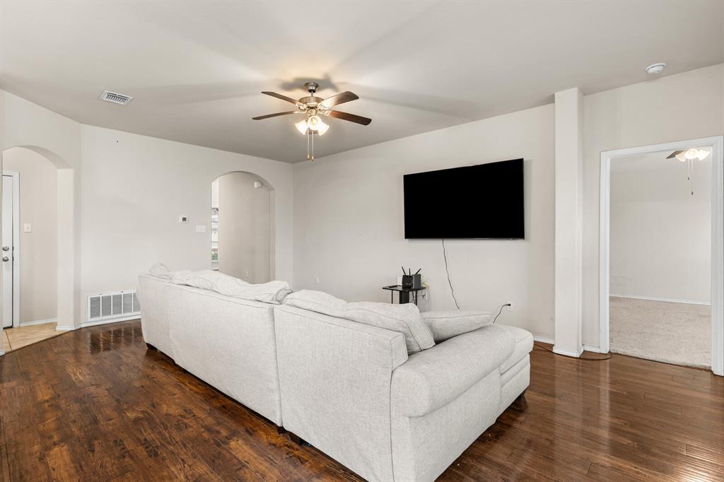 11233 Buzzard Gulch Drive Waco, TX 76708 - Photo 22 of 37 a living room with furniture and a flat screen tv