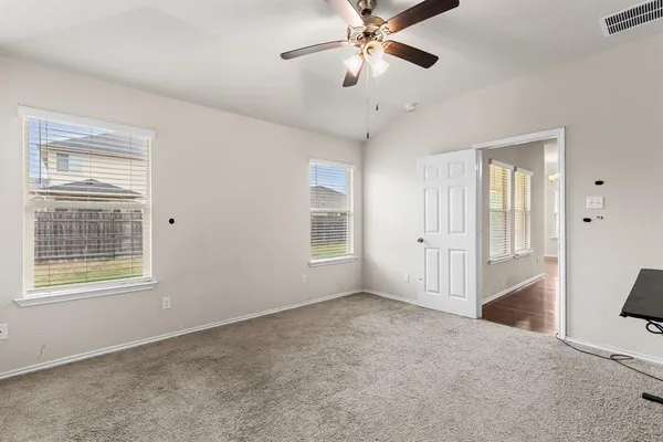 a view of an empty room with a window