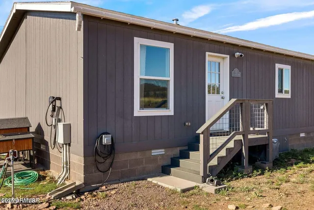 a front view of a house with wooden floor