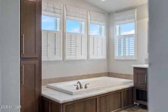 a bathroom with a sink and a window